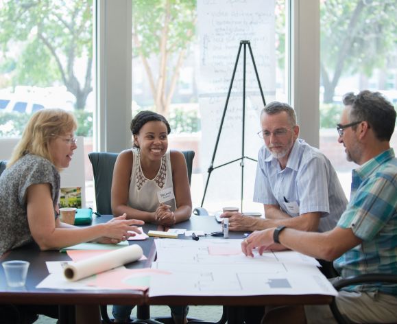 Students meet with program faculty at Open House breakout session.