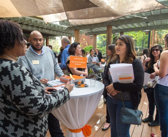 Students explore graduate programs at an open house event on the Sacramento campus.