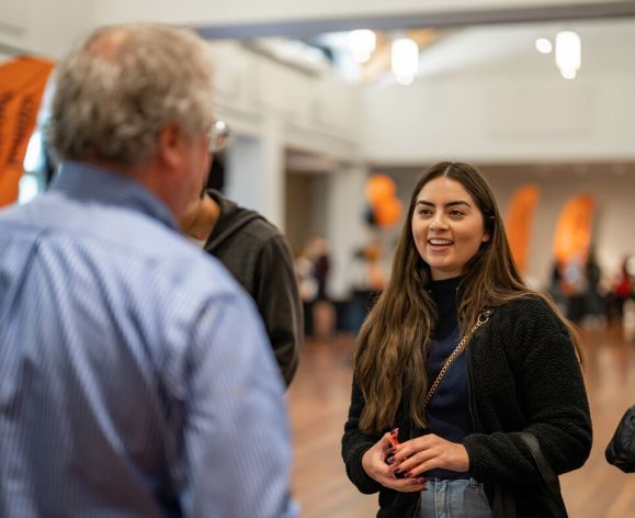 Student meets with program faculty at the 2022 Graduate Open House on University of the Pacific's campus in Stockton, CA.